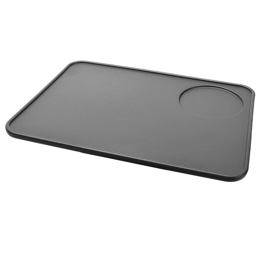 Espresso tamping mat in food grade silicon black. perfect espresso tool for baristas who want a tamping mat in front of their espresso machine